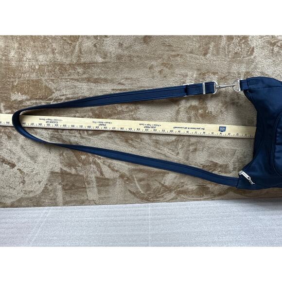 Travel on antitheft classic Crossbody bucket bag navy blue new without tags 
￼ - Picture 7 of 10